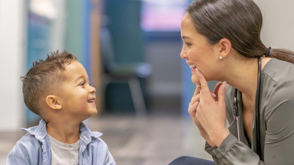 Child with a speech therapist