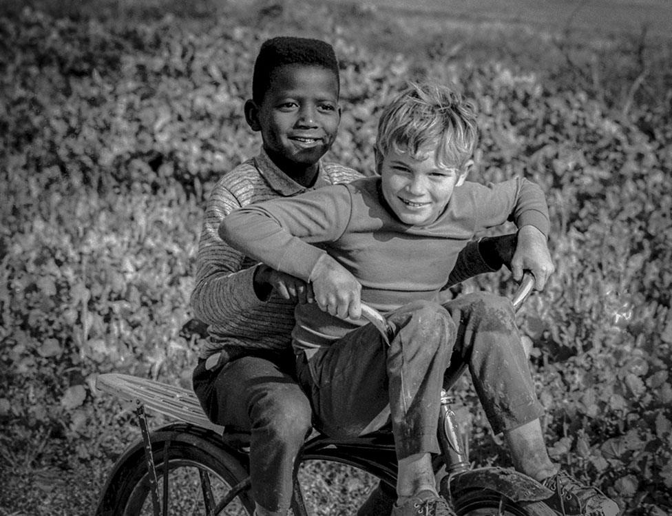 An image from a working-class area of Atlanta where white and black children played together, 1970