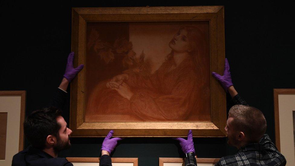 Gallery assistants install the work at the Fitzwilliam Museum, Cambridge