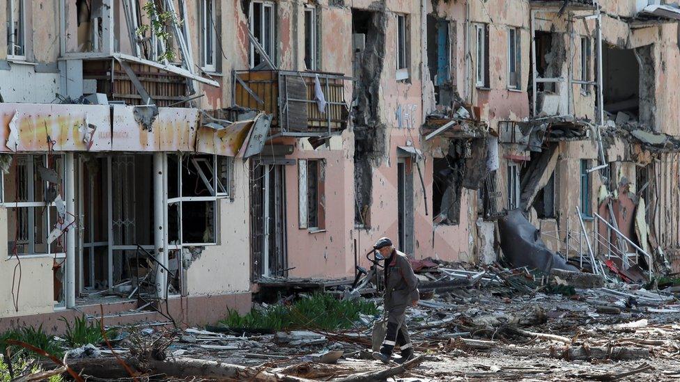 A view shows a damaged building in Mariupol