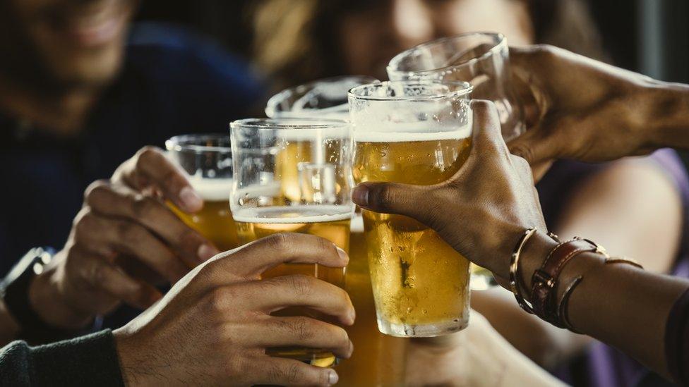 Drinkers in a bar - stock image