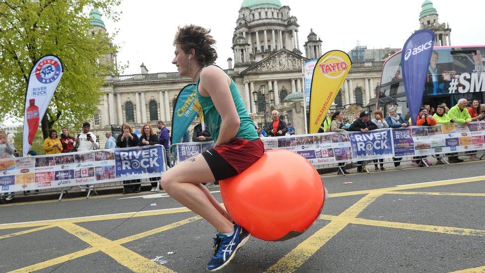 Man on space hopper attempting to bounce his way round Belfast