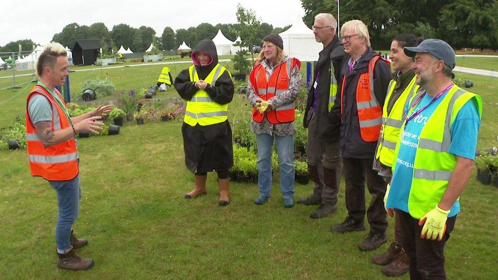 Lee Burkhill talking to team of community gardeners