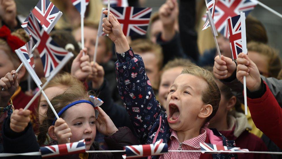 Children waving union jack flags