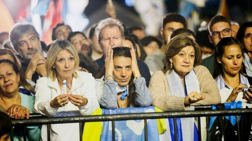 Supporters of National Party presidential candidate Luis Lacalle wait for the results after the second-round presidential election in Montevideo