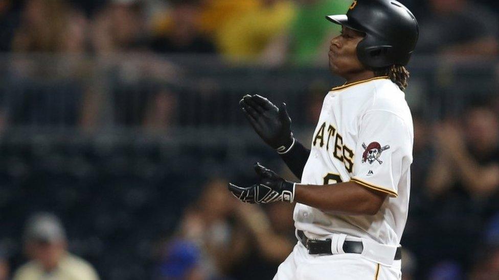 Pittsburgh Pirates second baseman Gift Ngoepe (61) reacts after recording his first major league hit against the Chicago Cubs