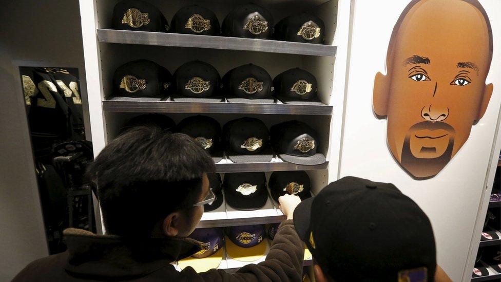 Fans shop for Kobe Bryant souvenirs in the Lakers store at Staples Center