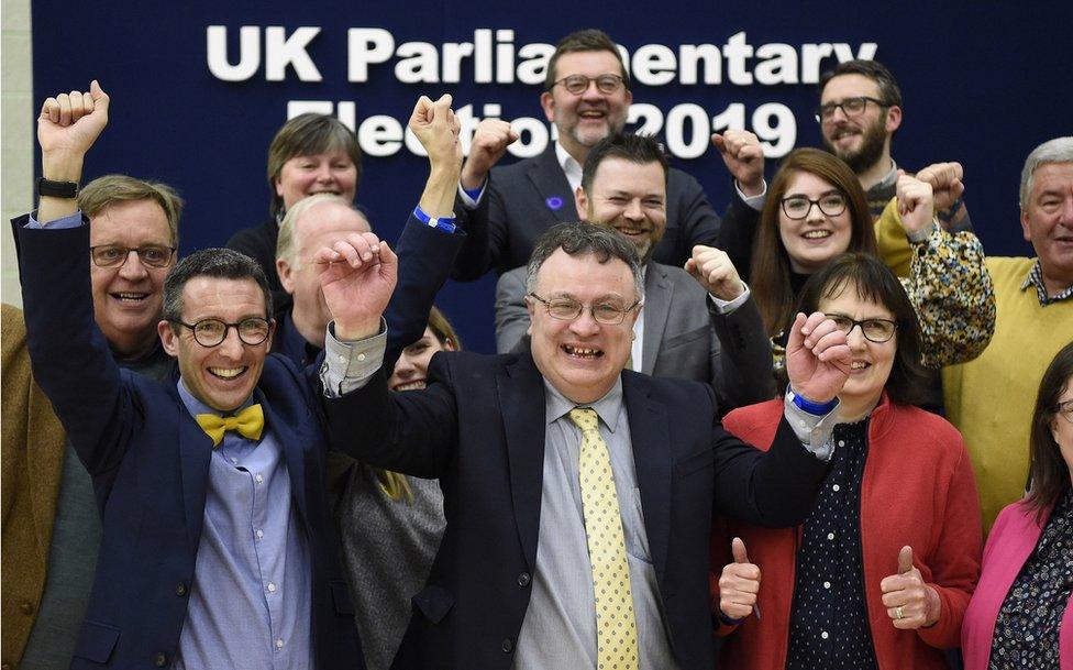 Stephen Farry celebrates with his Alliance Party colleagues