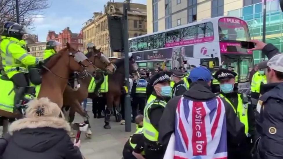 Protesters and police in Bradford