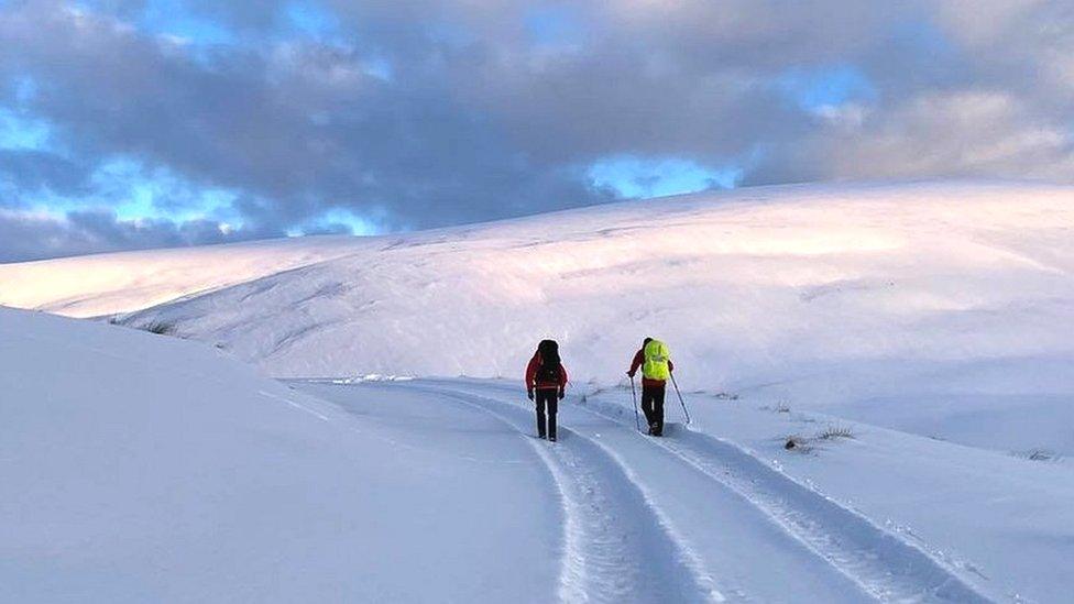 Rescuers in the snow