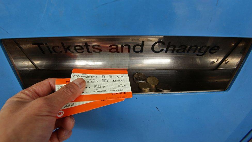 Man collecting train tickets