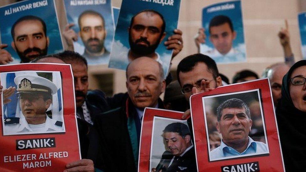 Family members hold photos of victims of the Mavi Marmara ship, the lead boat of a flotilla headed to the Gaza Strip, and three suspected Israeli commanders who stormed the vessel in a predawn confrontation, outside the city"s main courthouse after the trial in Istanbul, Friday, 9 December 2016.