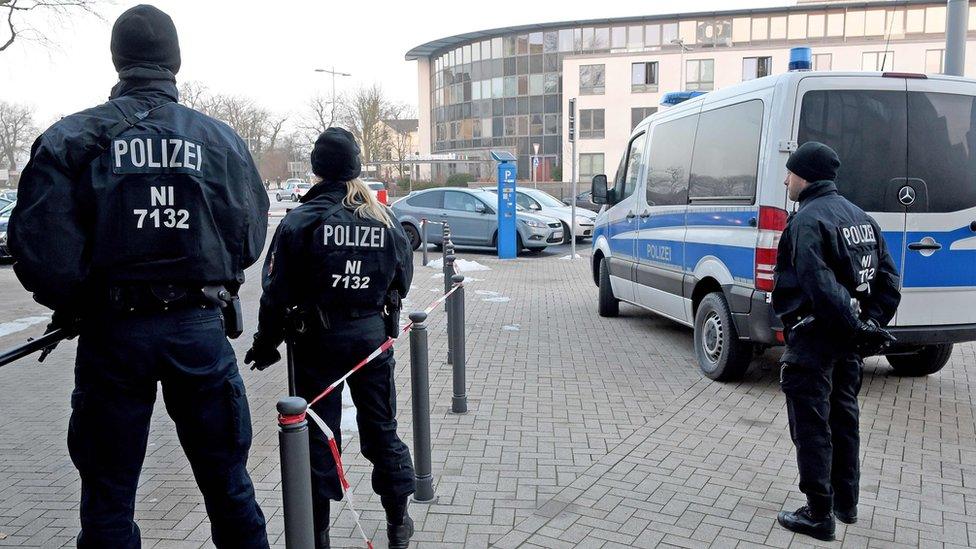 Policemen stand in front of the Higher Regional Court in Celle near Hannover as Safia S is sentenced