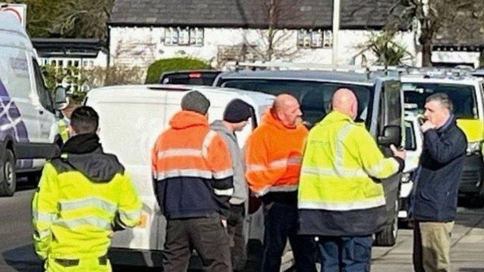 Protestors speaking to Openreach engineers in Wennington Road, Southport