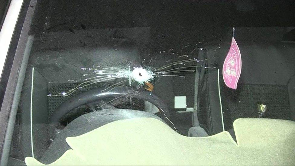 Car with bullet hole