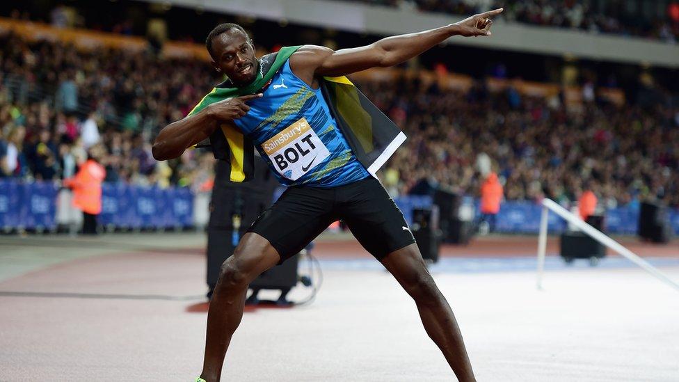 Usain Bolt strikes his hero pose