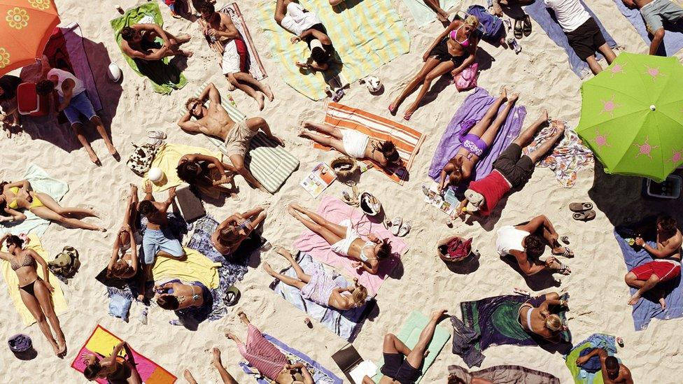 People sunbathing on a beach