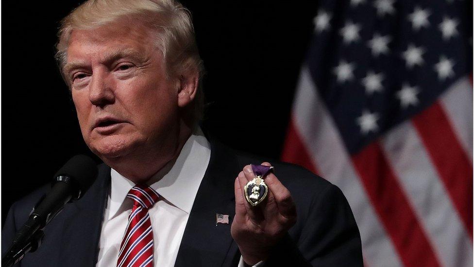 Trump holding purple heart