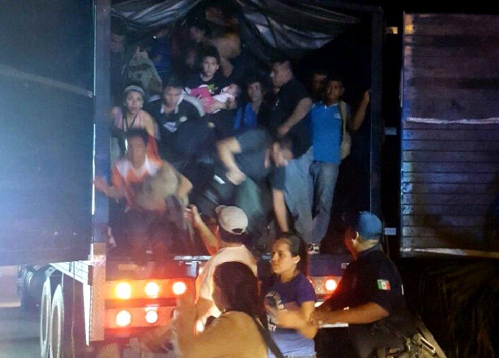 A handout picture provided by the National Institute of Migration of Mexico (INM) shows a group of migrants found by authorities in a truck, at a checkpoint in the highway connecting Villahermosa to Cardenas, Tabasco State, Mexico, 20 October 2016