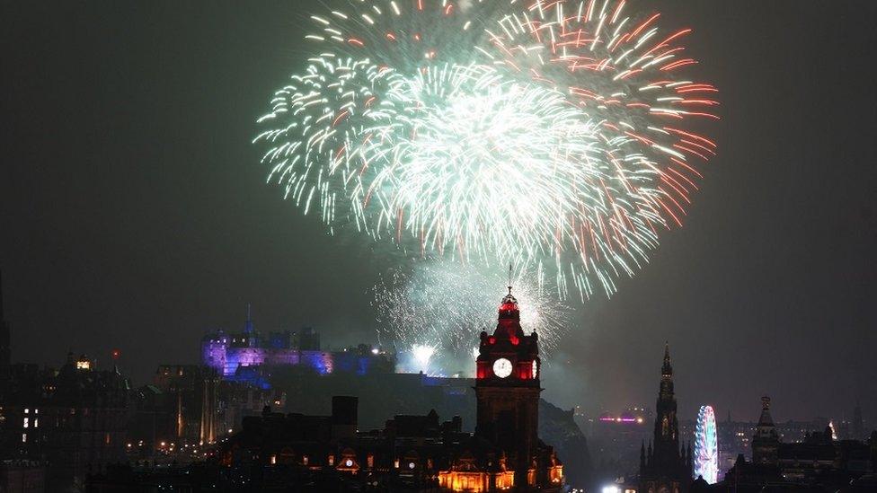 Fireworks explode over Edinburgh Castle during the street party for Hogmanay New Year celebrations in Edinburgh.