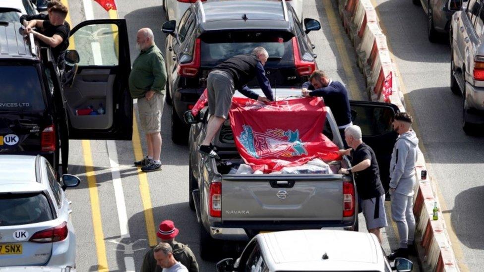 Liverpool supporters heading for the Champions League Final in Paris wait amongst freight and holiday traffic queues at the Port of Dover in Kent