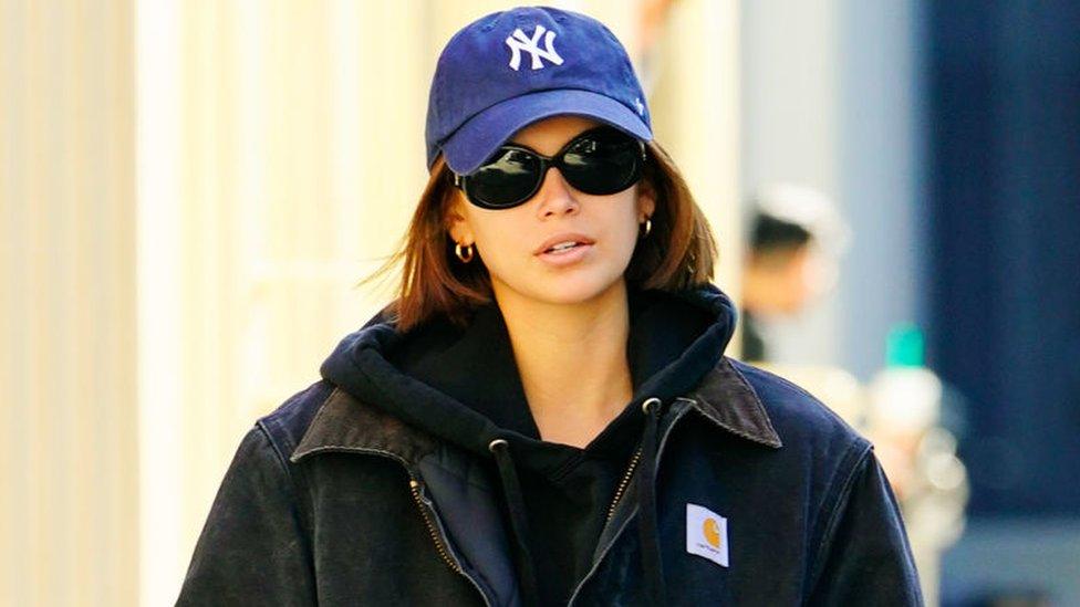 Model Kaia Gerber steps out in a Carhartt jacket