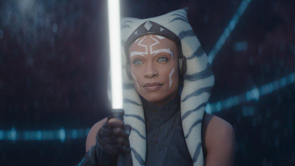 Title character from Ahsoka wielding a lightsaber