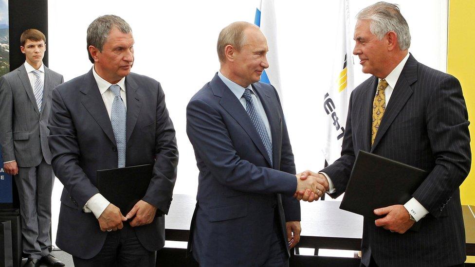 Russia's President Vladimir Putin (C), Rosneft Chief Executive Igor Sechin (L) and Exxon Mobil Chief Executive Rex Tillerson (R) take part in a signing ceremony at a Rosneft refinery in the Black Sea town of Tuapse, Russia June 15, 2012.