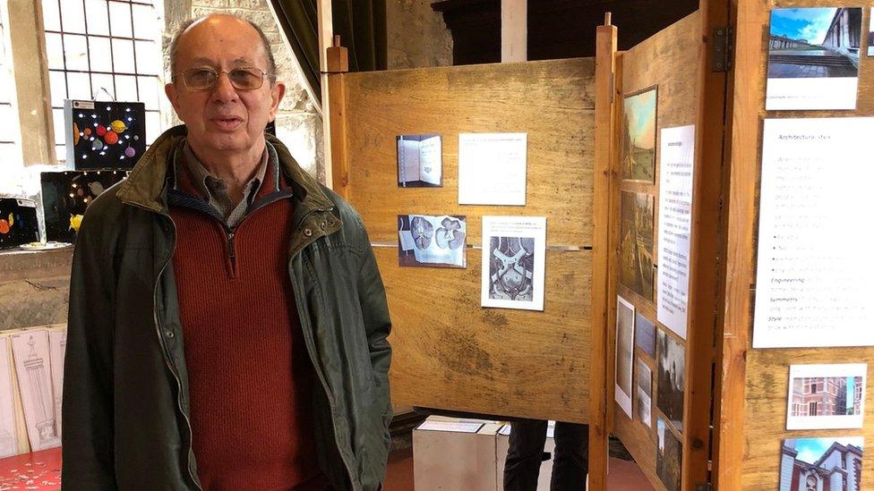 Eric Brunner standing among Christopher Wren exhibits