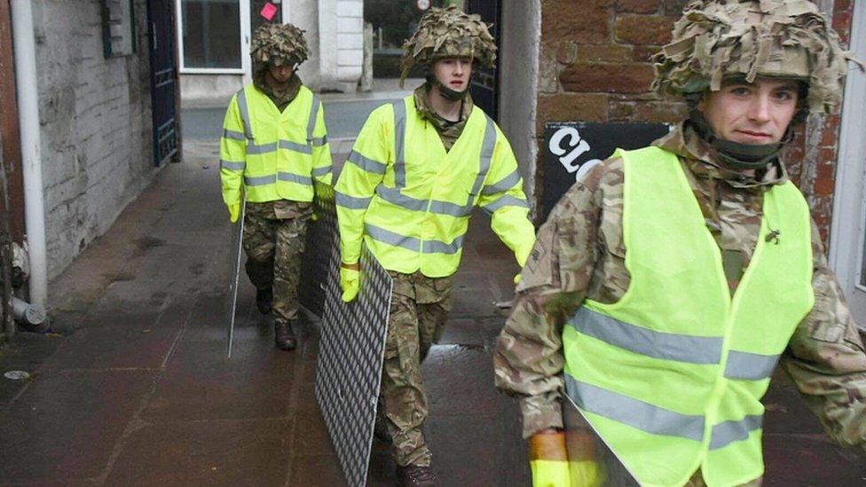 Soldiers from 2Lancs building flood defences in Appleby