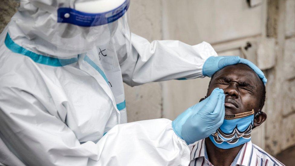 Health worker collects a sample in Nairobi