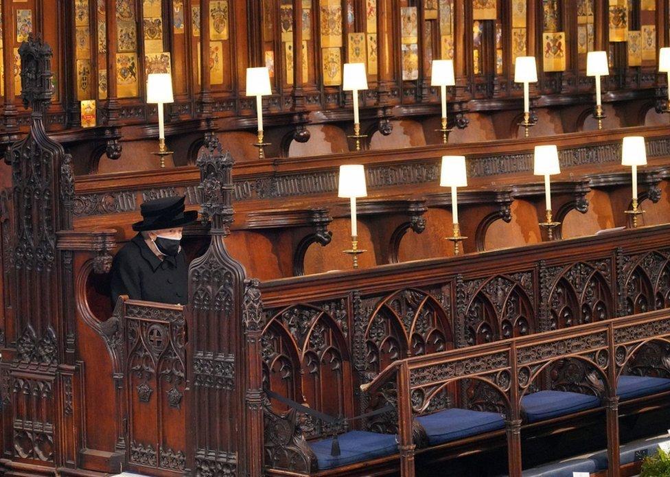 Queen Elizabeth II takes her seat for the funeral of the Duke of Edinburgh in St George's Chapel, Windsor Castle, Berkshire. 17 April 2021.