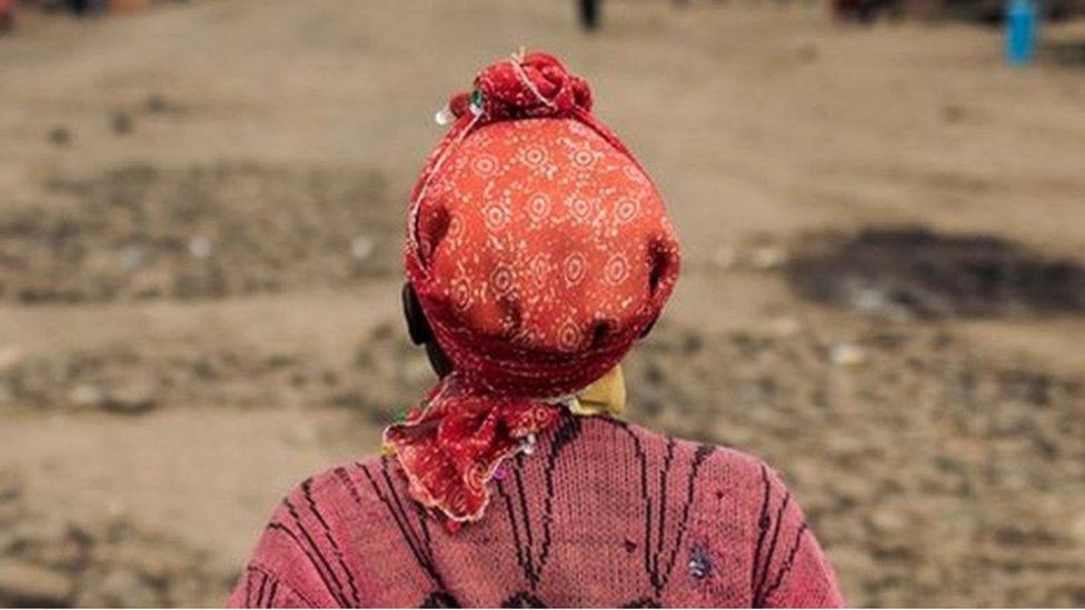 A woman crosses the Mweso market, Masisi Territory, eastern Democratic Republic of the Congo