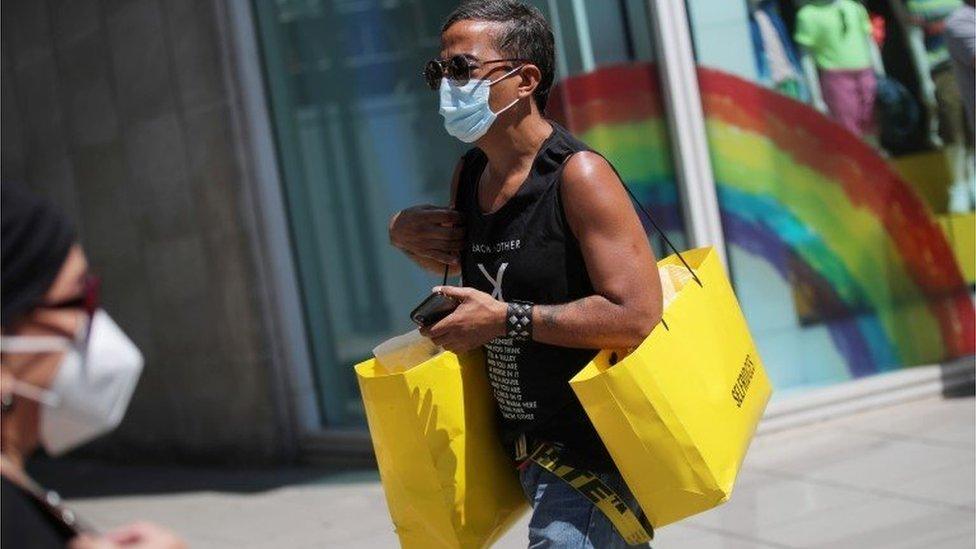 Man with Selfridges bags