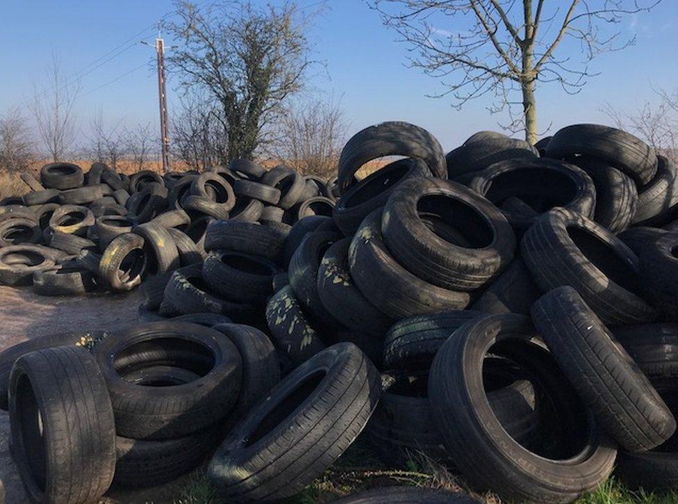 Huge pile of tyres dumped on land