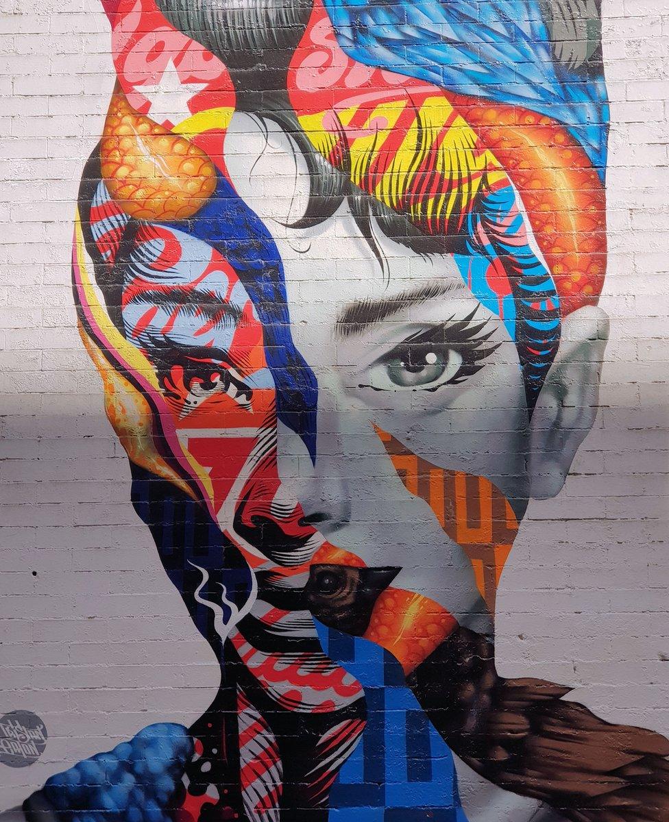 A mural of Audrey Hepburn in Little Italy, New York City