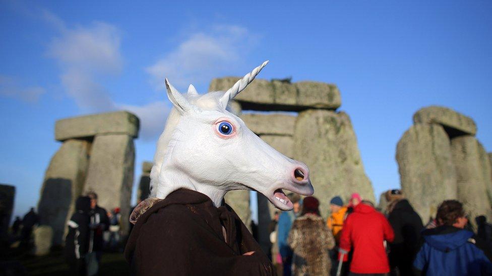 Unicorn-head-mask-woman-Stonehenge.