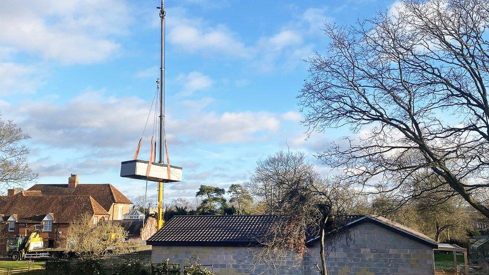 Spa pool lifted out by crane