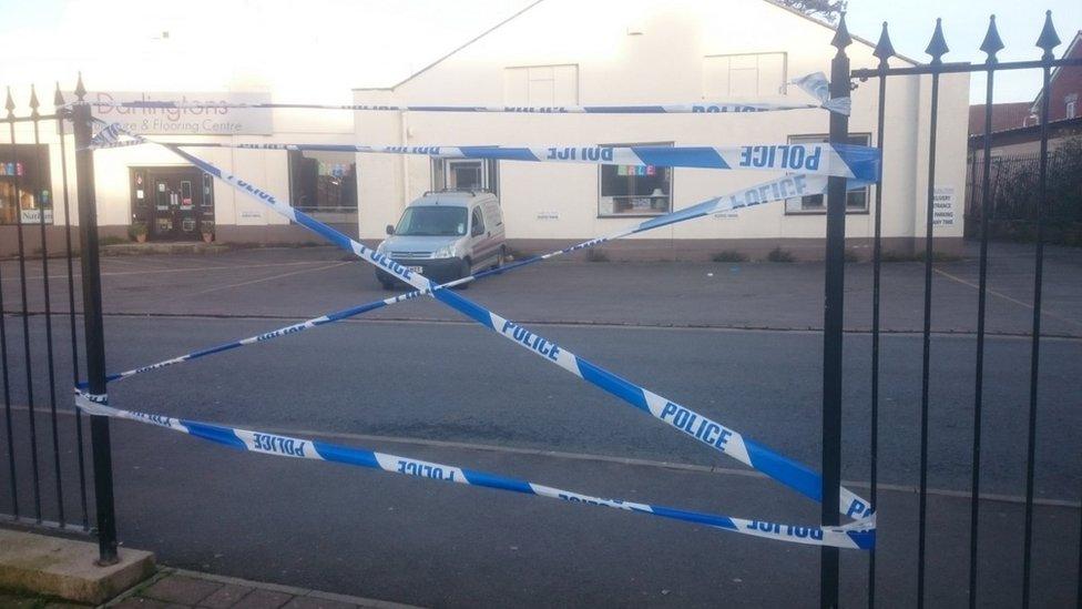 Police tape at hospital car park