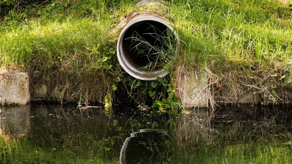 Sewage pipe at river