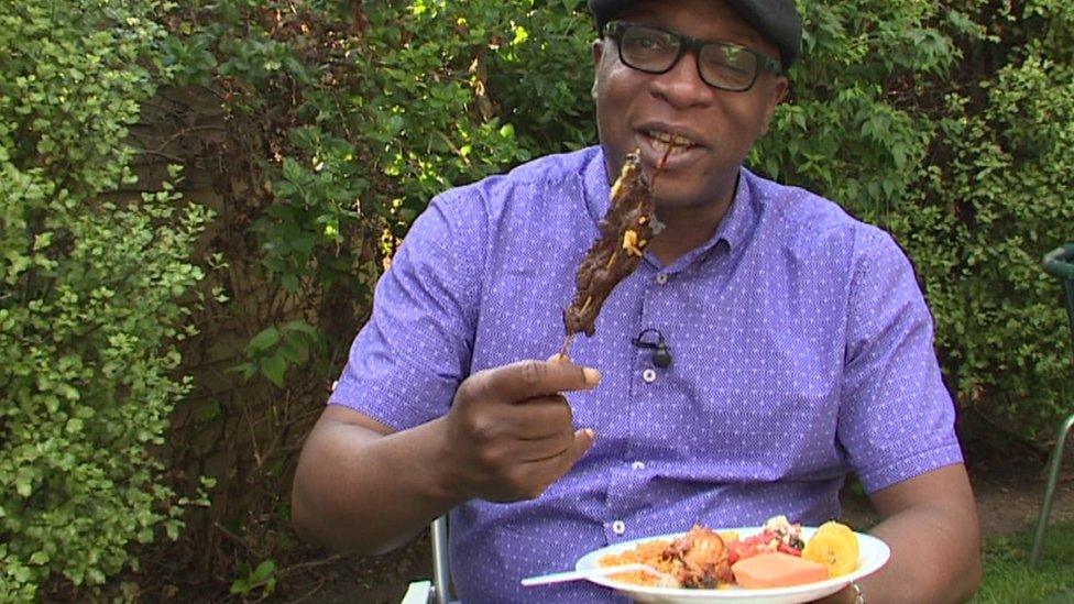 Peter Okwoche eating Nigerian food in London