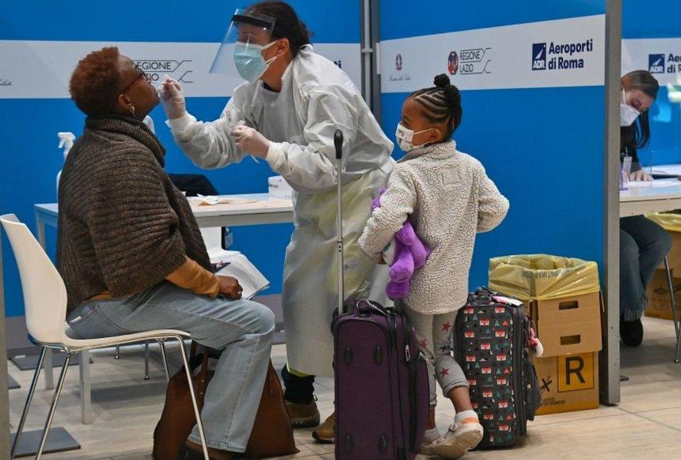 Visitor being tested for Covid-19 at Rome Fiumicino airport, 9 Dec 20