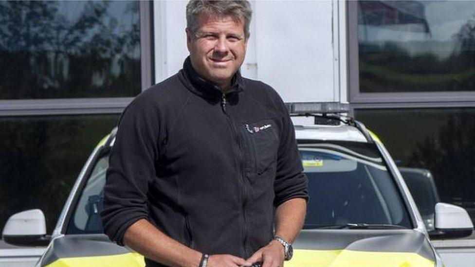 Tim Scothern by police car