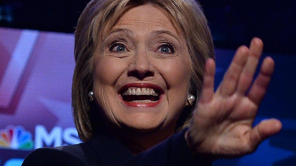 Hillary Clinton gesturing and smiling