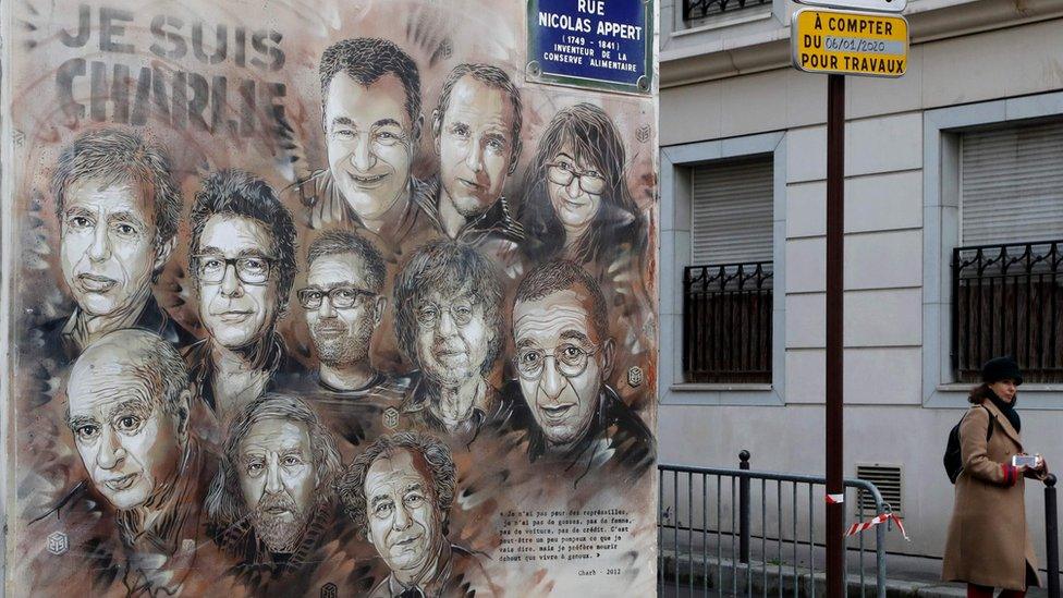 Artwork by French street artist Christian Guemy (aka "C215") depicting members of satirical magazine Charlie Hebdo painted on a facade near the magazine's offices at Rue Nicolas Appert, 7 January 2020