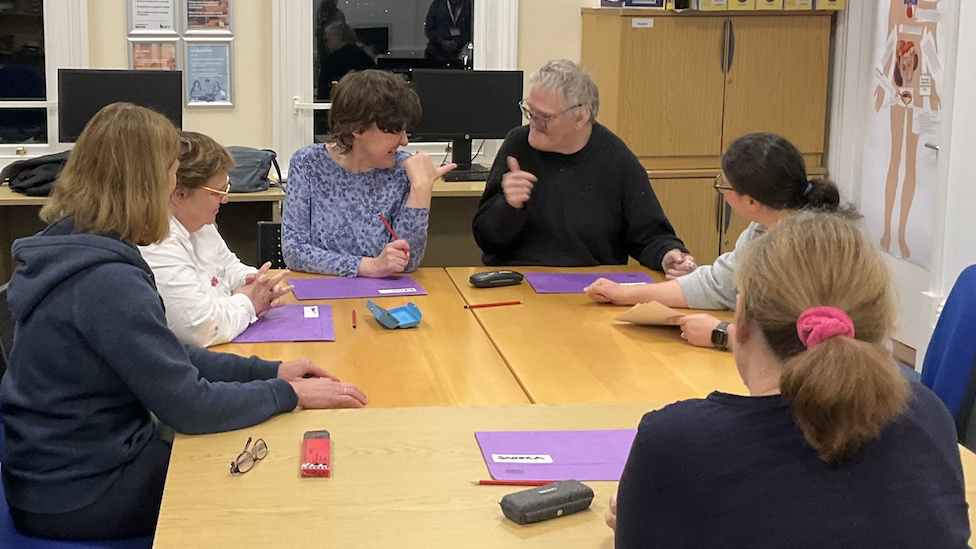 Students sat around a table