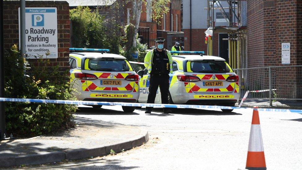 Surrey Police remain at the scene