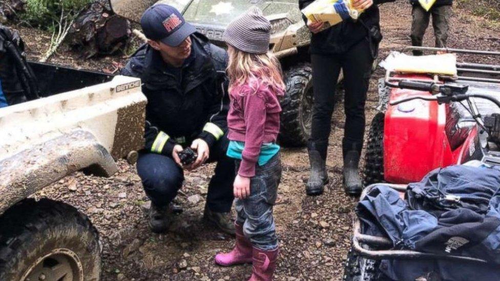 Caroline speaking with a firefighter