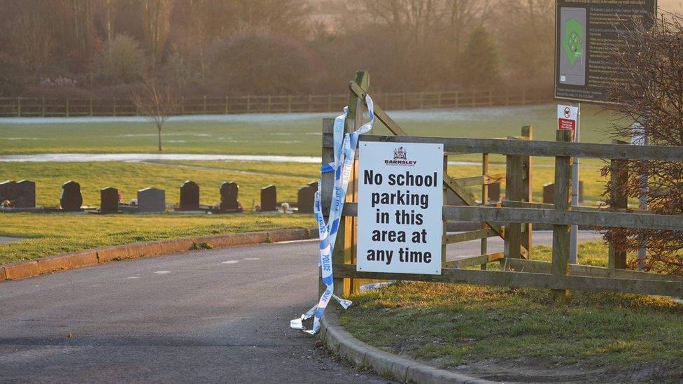 Police tape on a sign