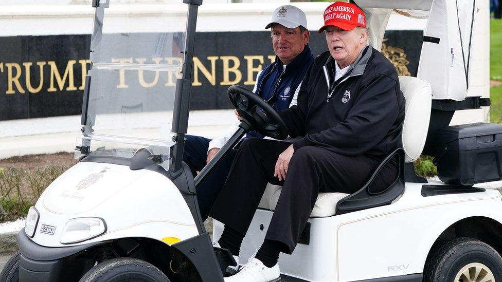 Donald Trump in golf buggy